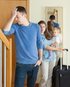 Woman with baby leaving home