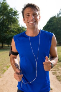 Young Man Jogging While Listening Music